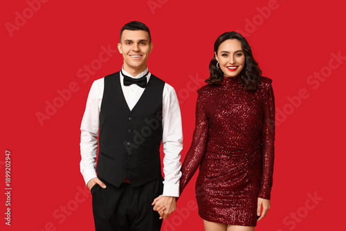 Loving young couple on red ...