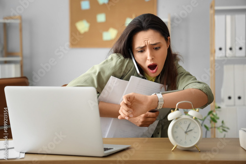 Stressed young businesswoma...