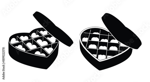 Two open heart shaped boxes of chocolates a striking silhouette