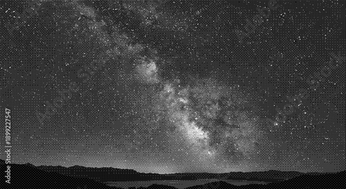 A serene night sky filled with stars and the Milky Way over a dark landscape viewed from a distance