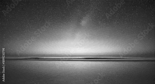 A serene seascape with fog, sea, and sky in a monochromatic landscape viewed from a distant perspective