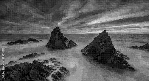 Rocky landscape with waves crashing against rugged shoreline at dusk from a low viewpoint
