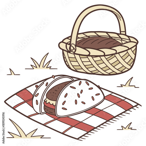 A picnic basket filled with food and a checkered blanket on the grass.