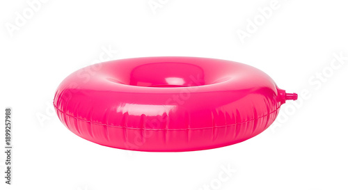 Inflated bright pink inner tube on black background