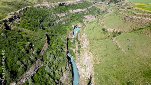 river in a stone canyon. river between rocks. green rocky gorge