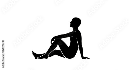 Silhouette of a woman sitting in a yoga pose.