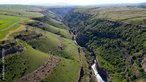 river in a stone canyon. river between rocks. green rocky gorge