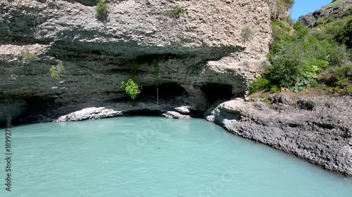 a lake in a stone canyon. a river between rocks.