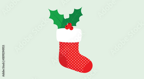 Red and white polka dot Christmas stocking decorated with green holly leaves and red berries for festive holiday celebration.