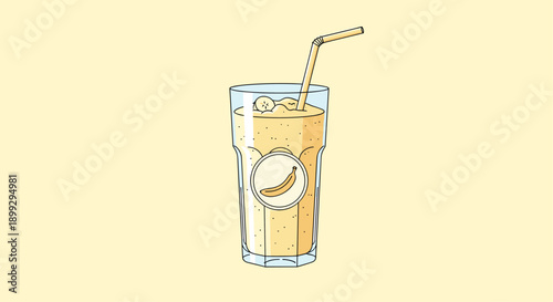 Refreshing banana smoothie in a tall glass featuring a yellow straw and a banana slice garnish for a healthy snack or drink.