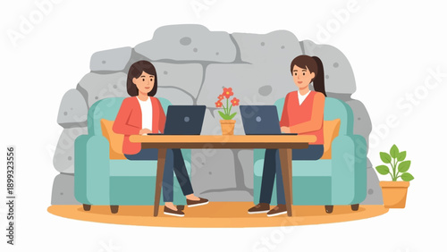 Two people working on laptops on a couch with a rock wall backdrop