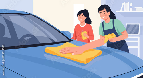Two women cheerfully drying a blue car with yellow cloths
