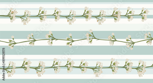Horizontal rows of delicate white blossoms on thin green stems set against a background of wide light blue and white horizontal stripes.