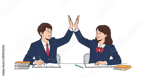Male and female students in school uniforms giving a high five while studying together at their school desk.