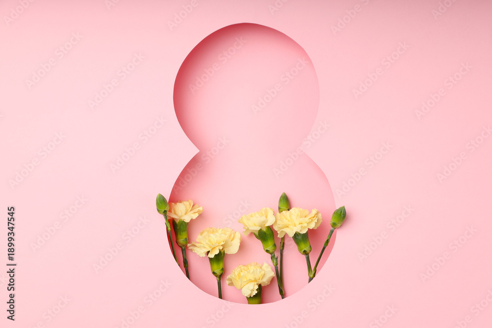 Obraz premium Colorful flowers are displayed behind a pink cutout number eight