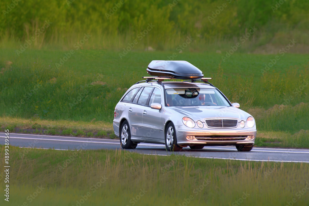 Fototapeta premium Sporty vehicle on asphalt countryside road