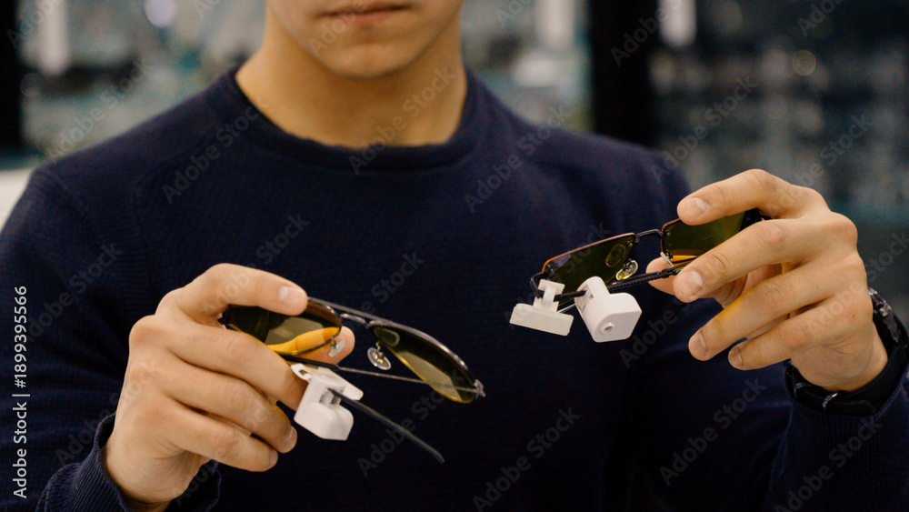 Fototapeta premium Close up of man holding different eyewear frames