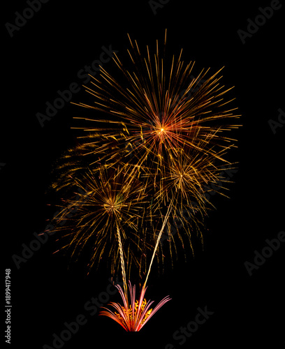 Golden firework sparkling on black background for celebration and anniversary