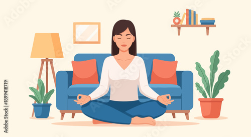 Woman meditating in lotus pose on floor in a cozy living room with blue couch