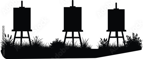 Silhouette of three rural water tanks on grassy landscape, representing agriculture irrigation, water storage system, environmental conservation