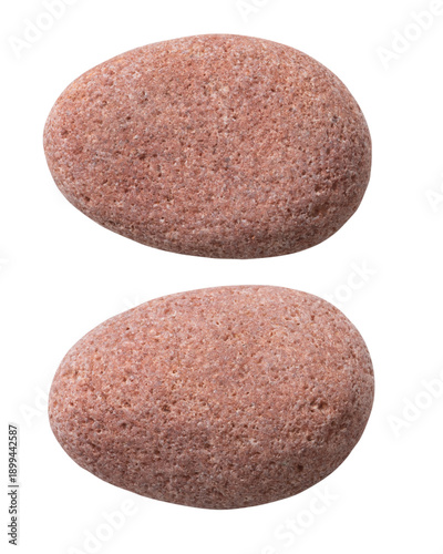 Two different sides of the same stone, isolated on a white background. Close-up of the pebble texture.