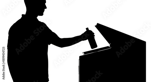 Man casting vote into ballot box at polling station
