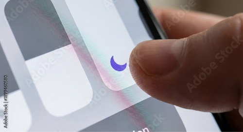 Thumb toggling Do Not Disturb moon icon on smartphone screen, digital wellness and focus mode concept.
