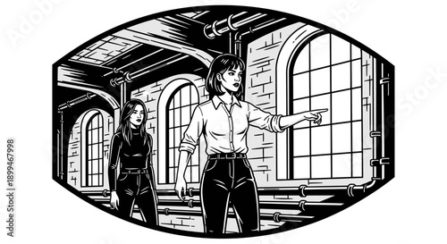 Two women in an industrial setting, one pointing towards a large window