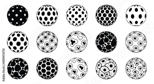 Arrangement of spherical objects with varying dot patterns in black and white