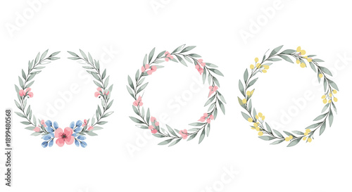Elegant floral wreaths with delicate pink and yellow flowers on white background