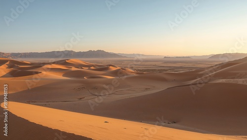 Wide View of Sand Dunes Under the Sun With Foothills in the Background During...