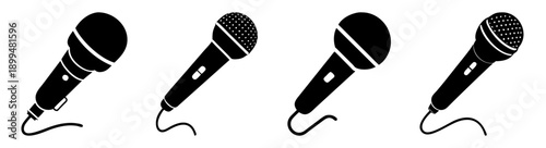 Set of four black microphones isolated on white background for speech, podcast, broadcast, and presentation use