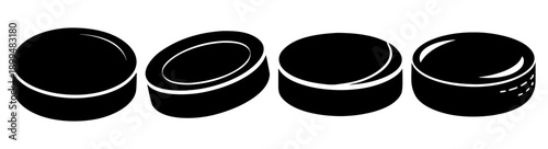 Set of four black hockey pucks with blue stripes isolated on white background for sports and game design