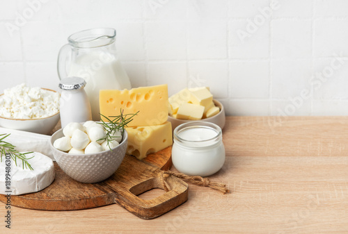 Assortment of fresh dairy products on wooden table