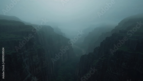 Misty Valley Landscape Showing Cliffs and Canyon During Overcast Weather in t...