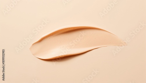 Creamy Texture of Foundation Spread on a Smooth Surface in Neutral Tones Duri...