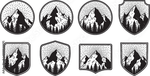 Vintage mountain and forest emblems set with sun rays in various badge shapes.