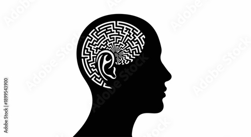 Silhouette of a head with a maze representing the complex human brain and thought process