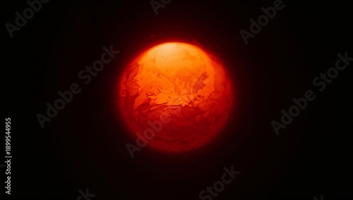 View of a Glowing Red Ball in a Dark Environment During Nighttime