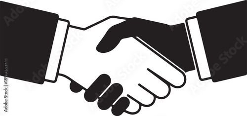 Handshake between two individuals in a business setting, symbolizing partnership and agreement.