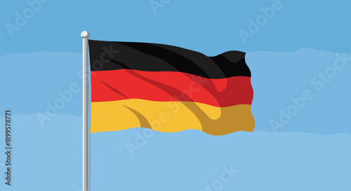 German flag waving against a clear blue sky