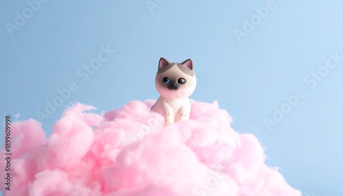 Adorable Kitten Sitting on Pink Cotton Candy.