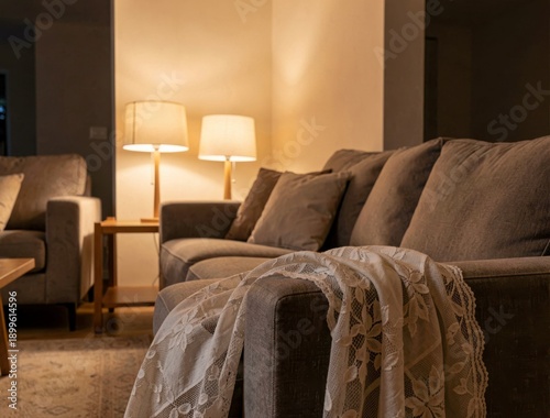 Cozy living room with soft lighting and floral lace throw on sofa
