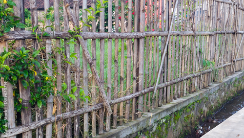 Simple Bamboo Plank Bridge Crossing a Rural Drainage Ditch