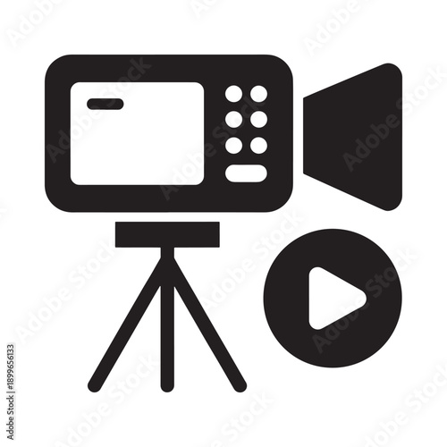 A black and white icon depicting a vintage camcorder with a record button