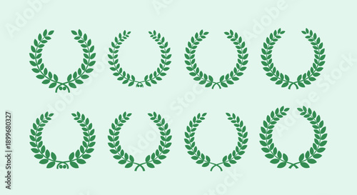 Collection of green laurel wreaths on a light green background.