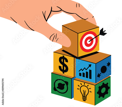 A hand placing a block with a target and arrow on top of other blocks with business and finance symbols.