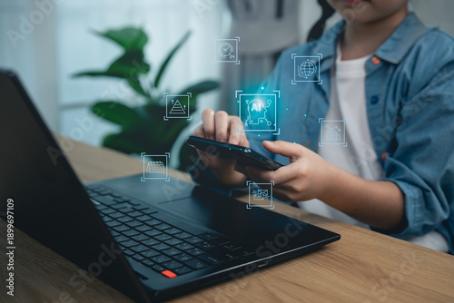 Close-up, Hand girl using magnifying glass with laptop and virtual security shield, concept of cyber safety, data analysis, internet privacy protection, and digital literacy for children