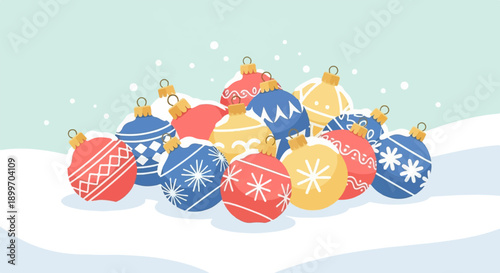 A pile of decorative Christmas ornaments scattered in the snow