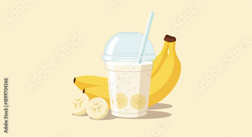 A refreshing banana smoothie in a clear cup with sliced fruit and whole bananas